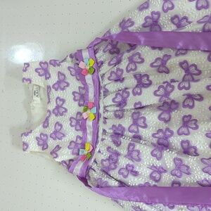 Girls dress with embroidered details and waist ribbon